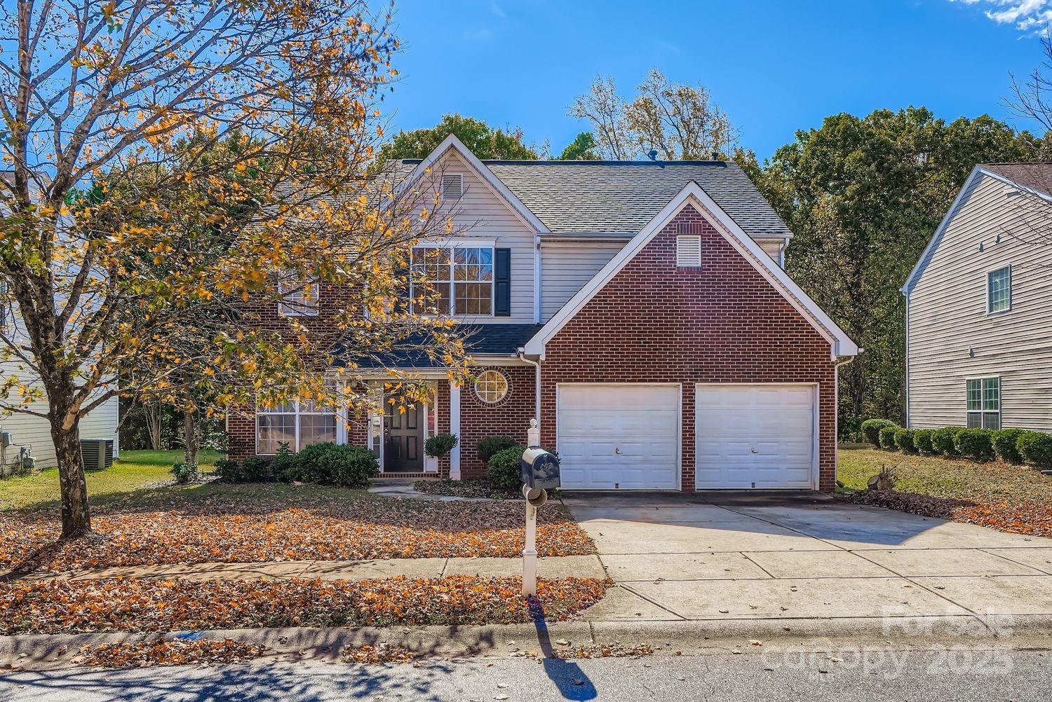11609 Erwin Ridge Avenue Charlotte, NC 28213 - Photo 1 of 29 a front view of a house with a yard