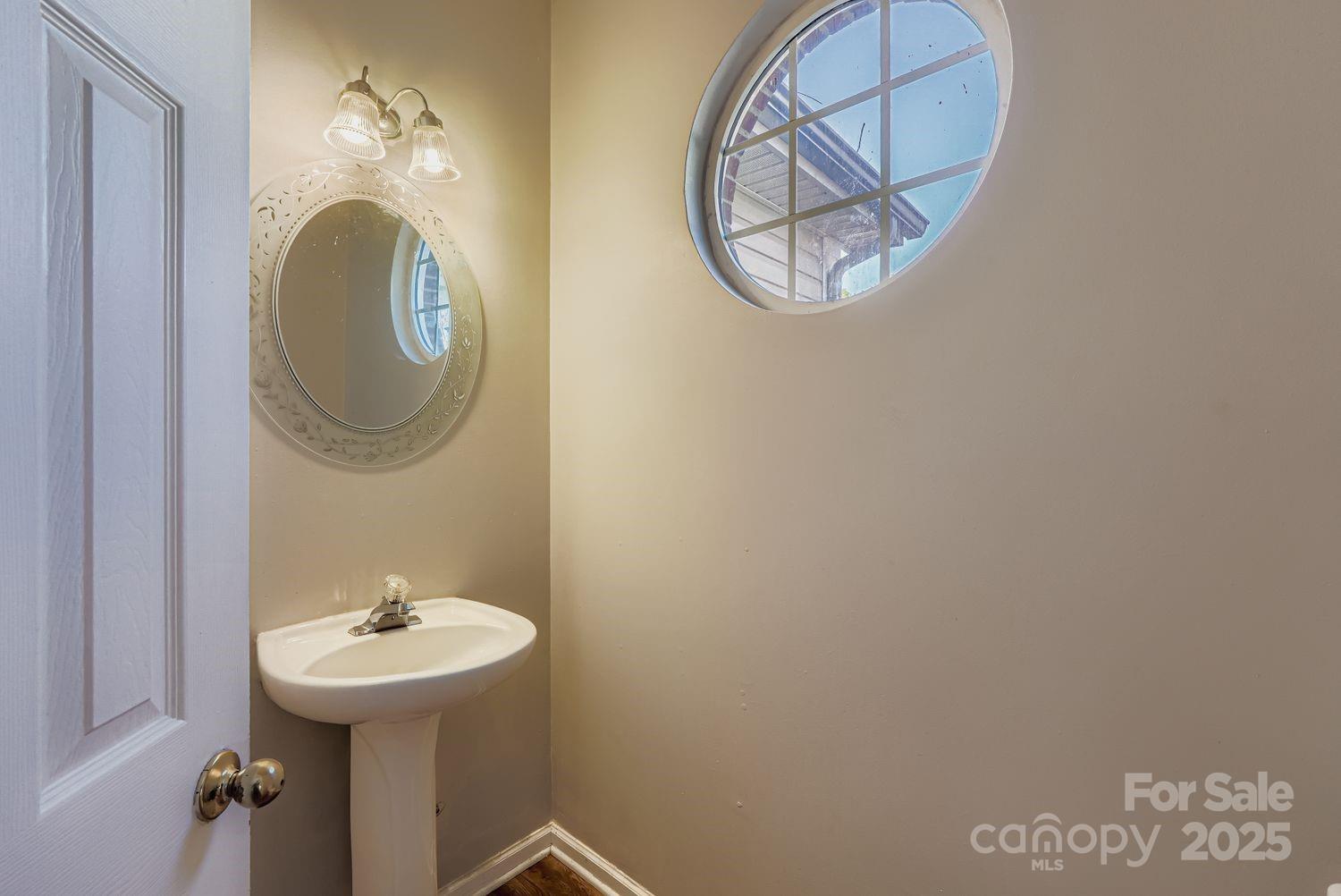 11609 Erwin Ridge Avenue Charlotte, NC 28213 - Photo 11 of 29 a bathroom with a sink and a mirror