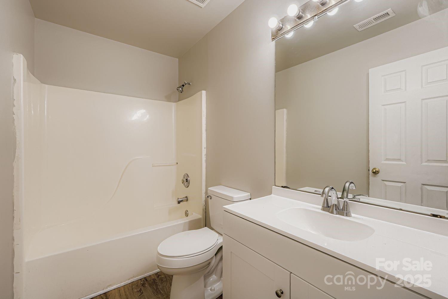 11609 Erwin Ridge Avenue Charlotte, NC 28213 - Photo 17 of 29 a bathroom with a sink toilet vanity and shower