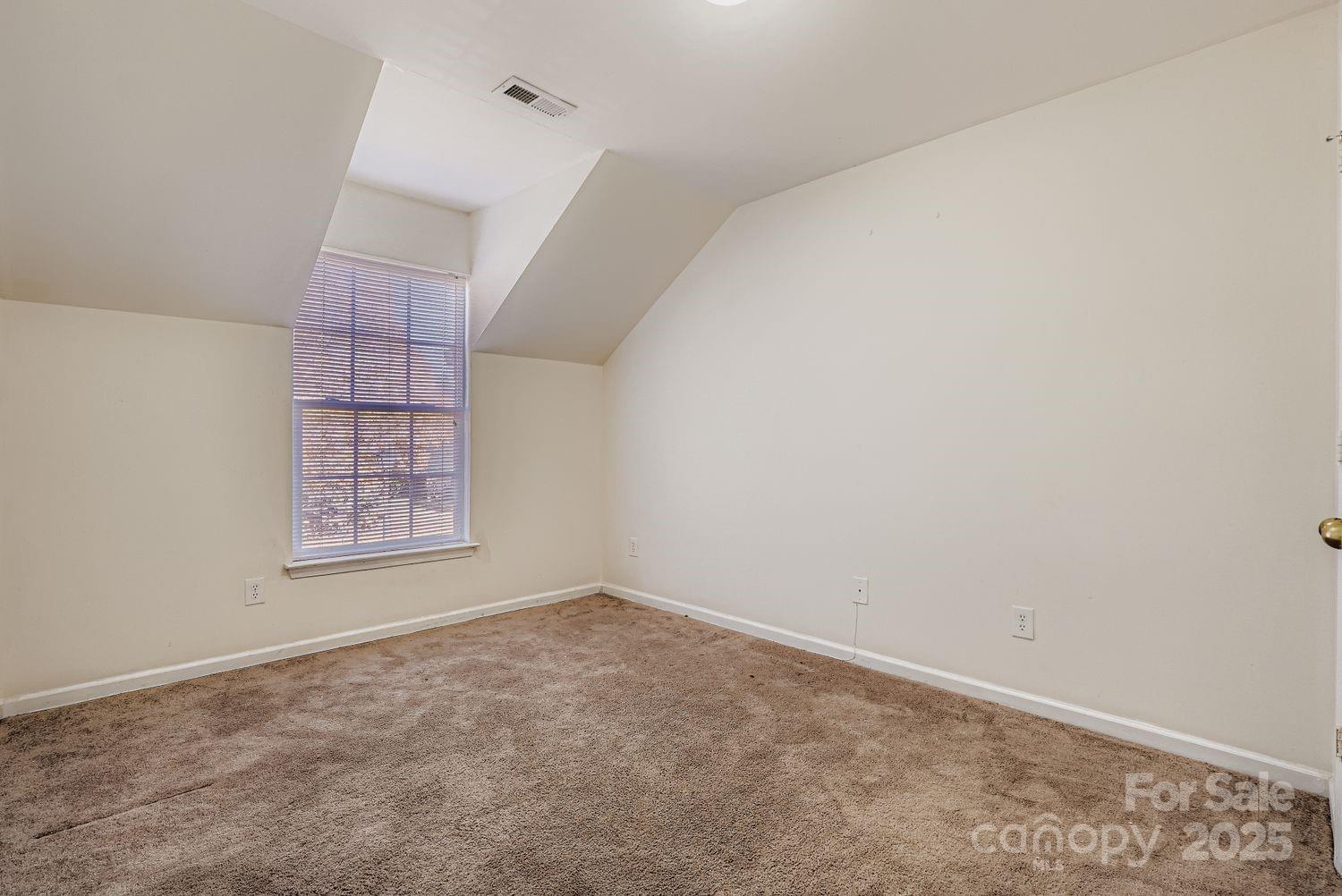 11609 Erwin Ridge Avenue Charlotte, NC 28213 - Photo 19 of 29 an empty room with windows
