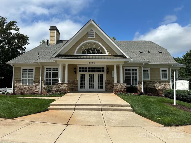 a view of a swimming pool with a chairs