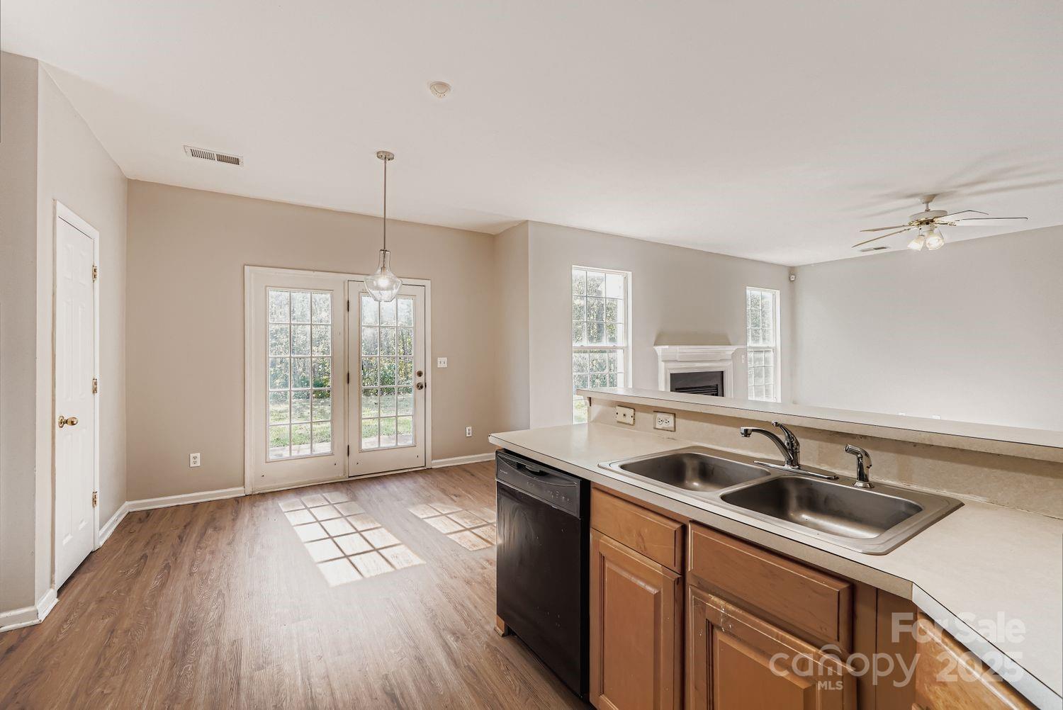 11609 Erwin Ridge Avenue Charlotte, NC 28213 - Photo 8 of 29 a kitchen that has a sink stove and cabinets