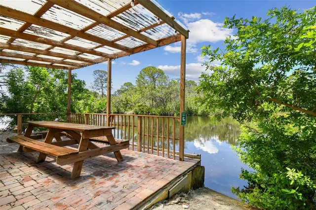 a view of a backyard with chairs