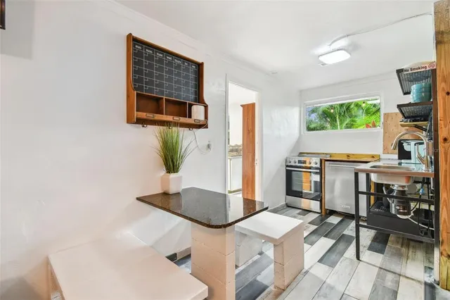 a view of a sink and a microwave