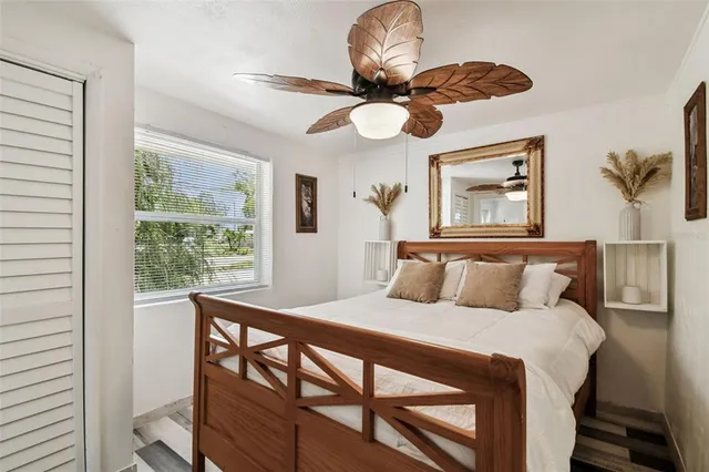 a bedroom with a bed and a window