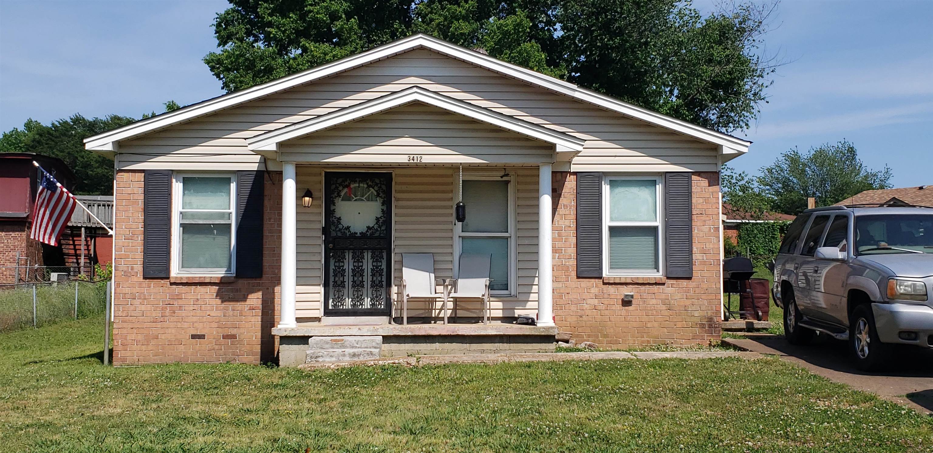 3412 Rebeh Road Memphis, TN 38109 - Photo 1 of 1 a front view of a house with a yard
