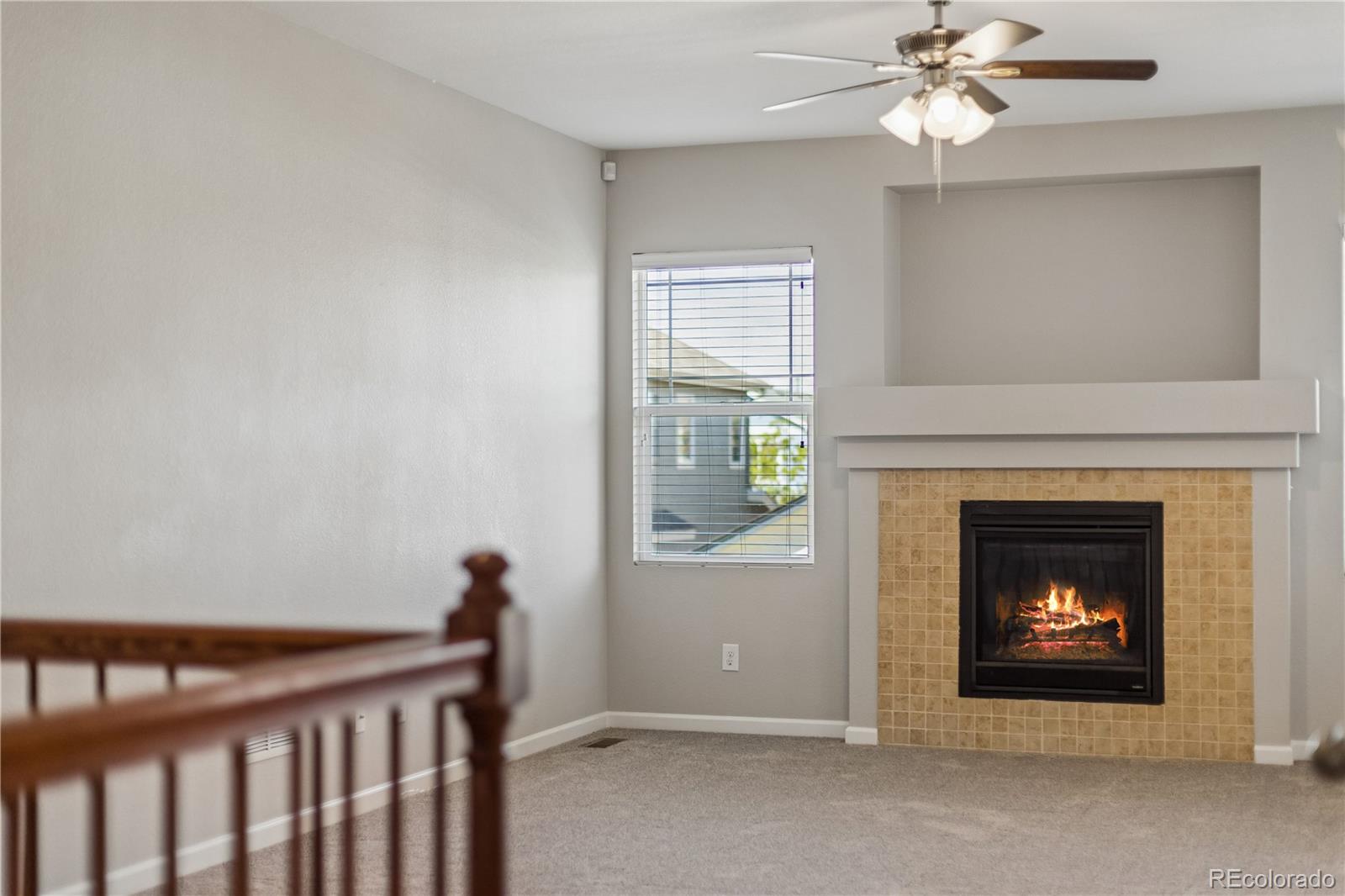 5031 South Rome Street Aurora, CO 80015 - Photo 6 of 39 a living room with furniture and a fireplace