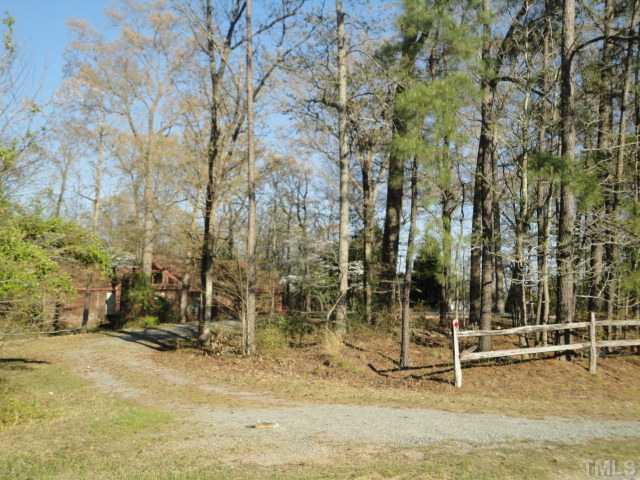 1862 Guy Road Angier, NC 27501 - Photo 3 of 7 a backyard of a house with lots of green space