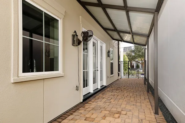 a view of a porch with wooden floor and stairs