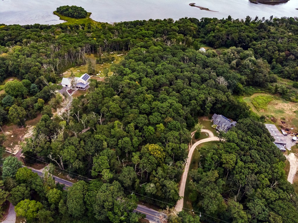 234 Old Harbor Road Westport, MA 02790 - Photo 13 of 16 an aerial view of a houses with a lush green forest