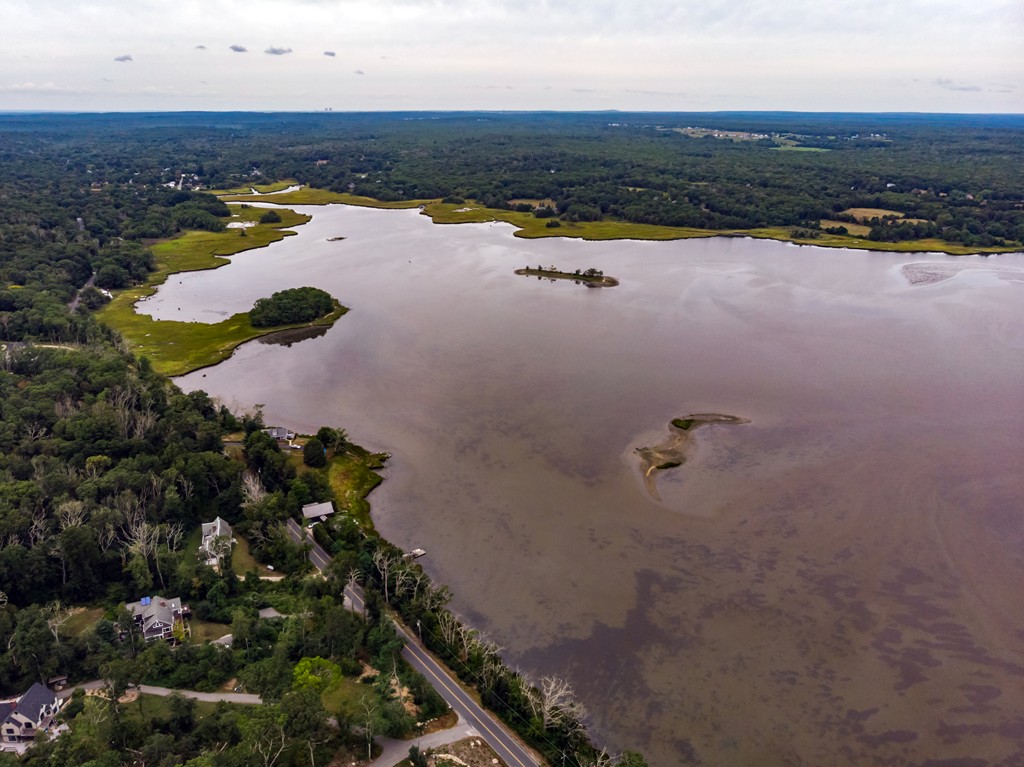 234 Old Harbor Road Westport, MA 02790 - Photo 8 of 16 an aerial view of residential houses with outdoor space