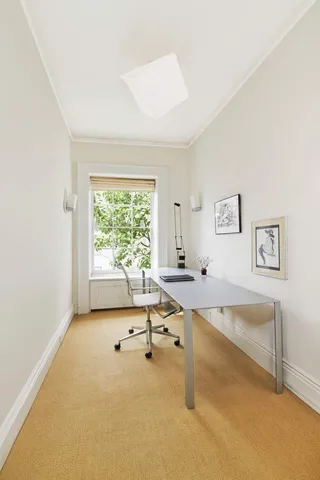 a very nice looking room with a large window and a couch