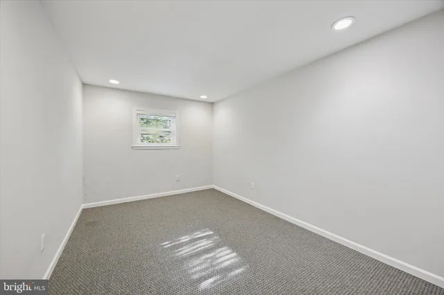 an empty room with a empty space and a window