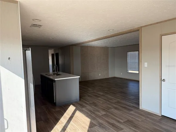 a view of a kitchen from the hallway