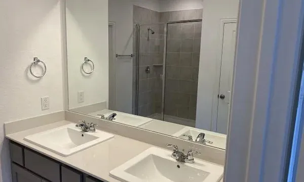 a view of a backyard with wooden fence