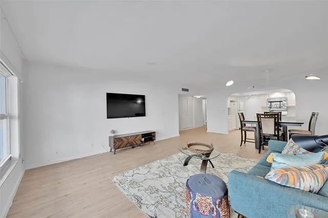 a kitchen with white cabinets stainless steel appliances and sink