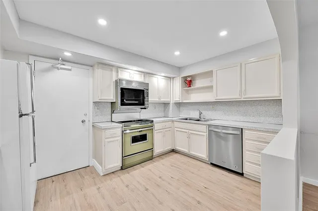 a bedroom with a bed a table and window