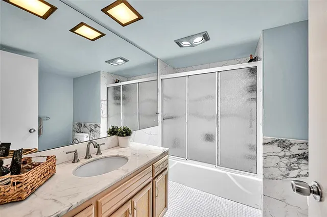 a view of a chair and tables in the balcony