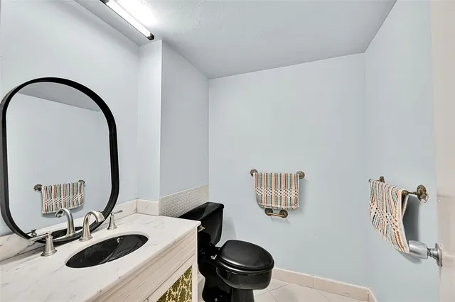 a balcony with furniture and a potted plant