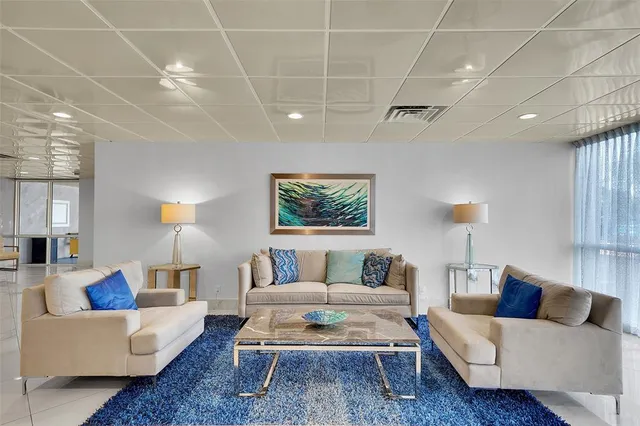 a living room with lots of furniture and a flat screen tv