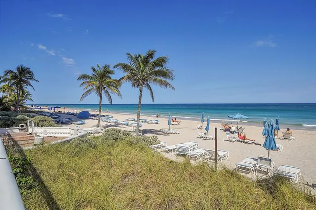 a view of a a dining room with furniture and wooden floor
