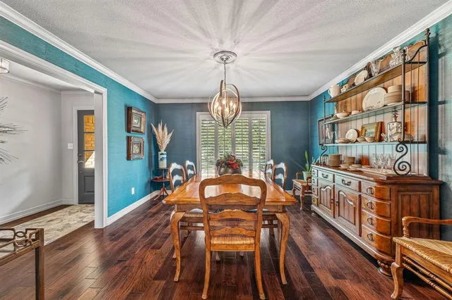a kitchen with a sink appliances and cabinets