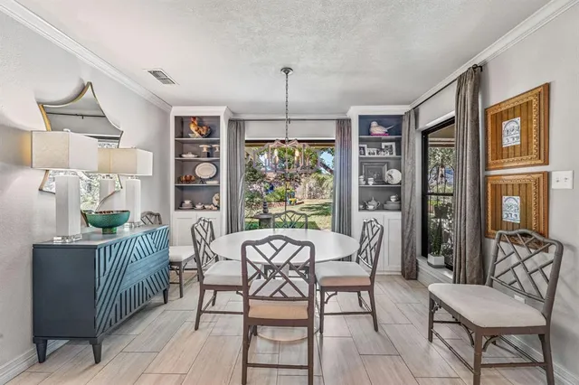 a view of a livingroom with furniture and a flat screen tv