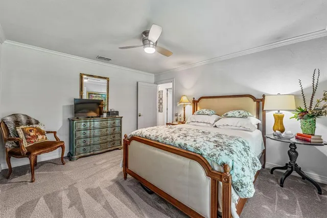 a view of a patio with table and chairs potted plants