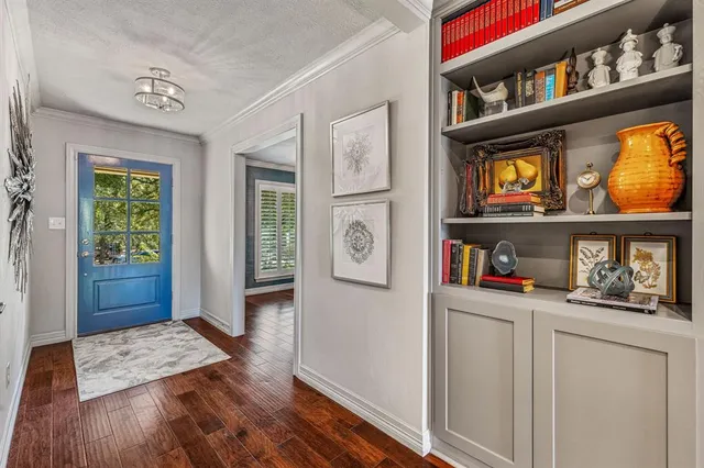a living room with furniture a fireplace and a table