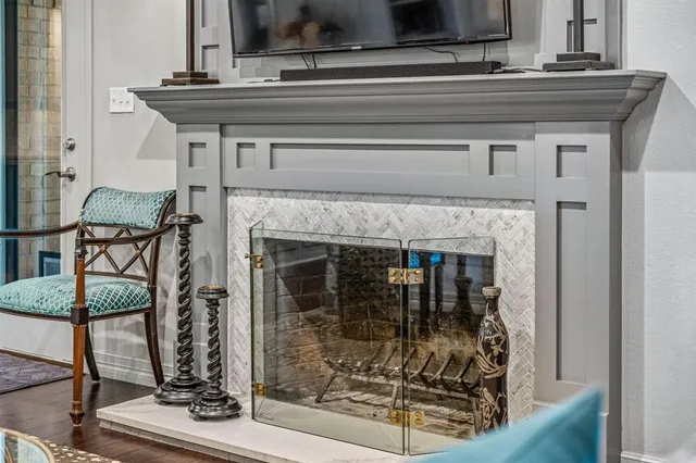a living room with lots of furniture and a wooden floor