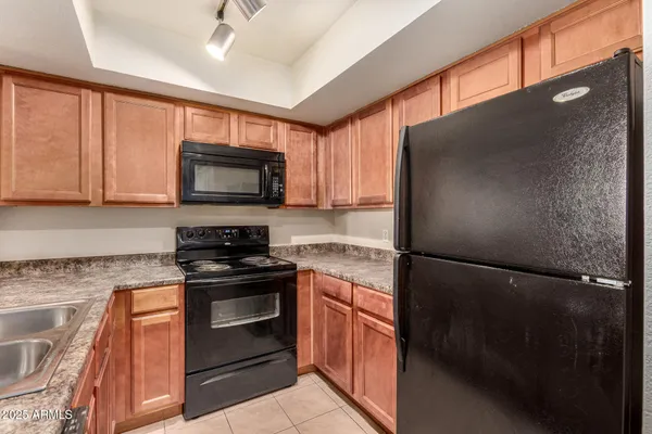 a kitchen with a refrigerator stove and microwave