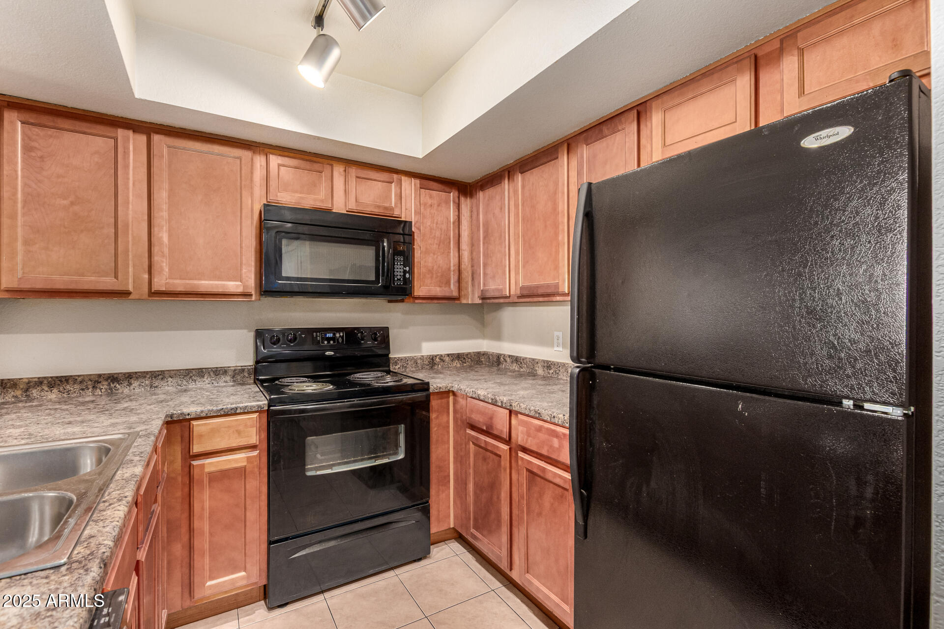 1331 West Baseline Road, Unit 167 Mesa, AZ 85202 - Photo 12 of 42 a kitchen with a refrigerator stove and microwave