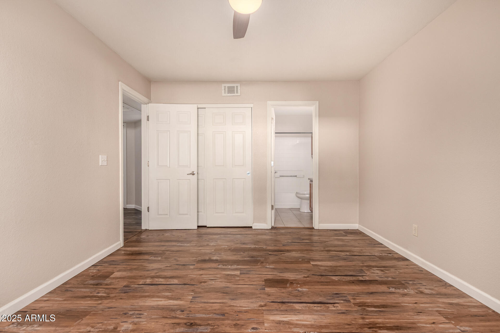 1331 West Baseline Road, Unit 167 Mesa, AZ 85202 - Photo 20 of 42 a view of room with window and hardwood floor