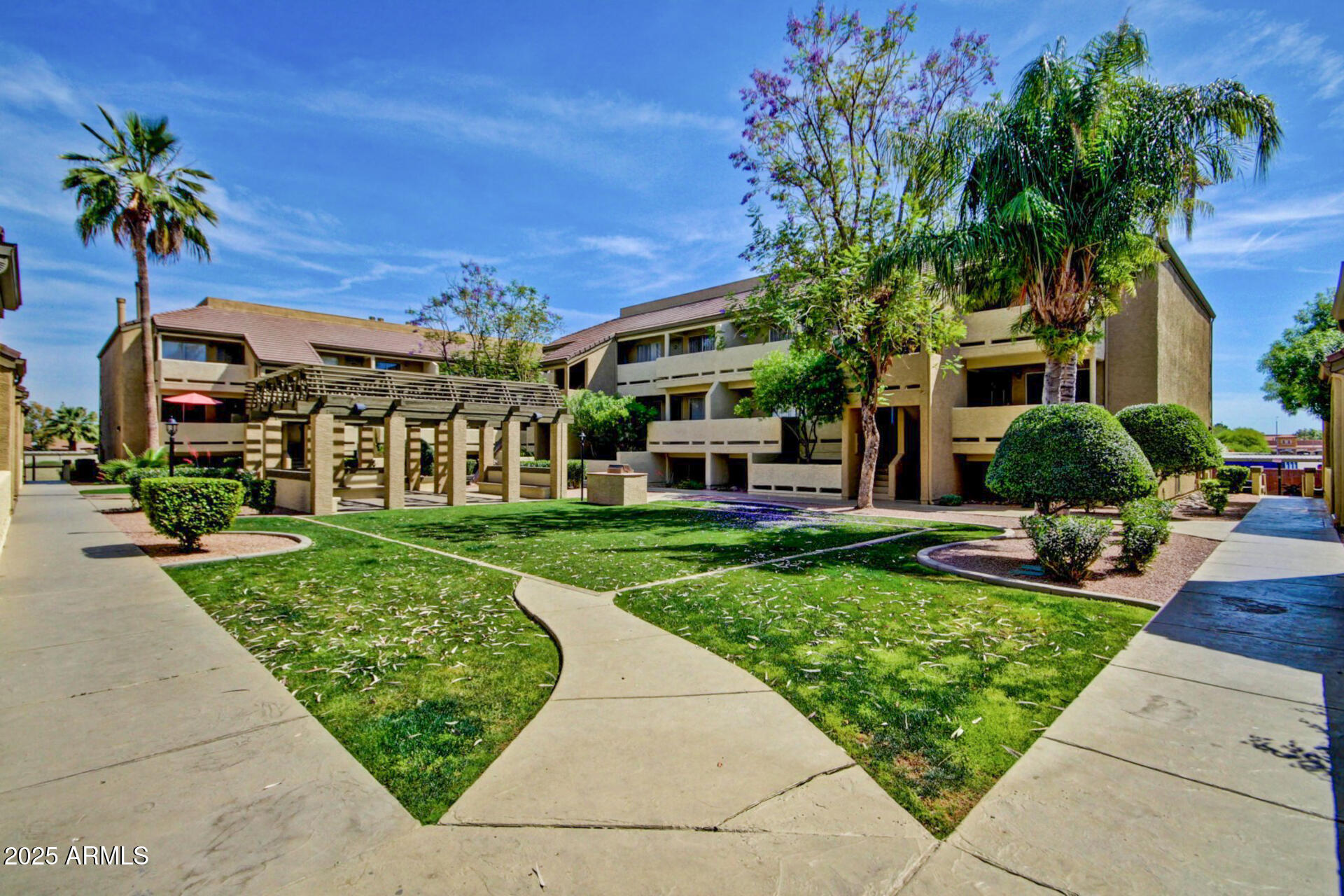1331 West Baseline Road, Unit 167 Mesa, AZ 85202 - Photo 29 of 42 a front view of a house with a yard