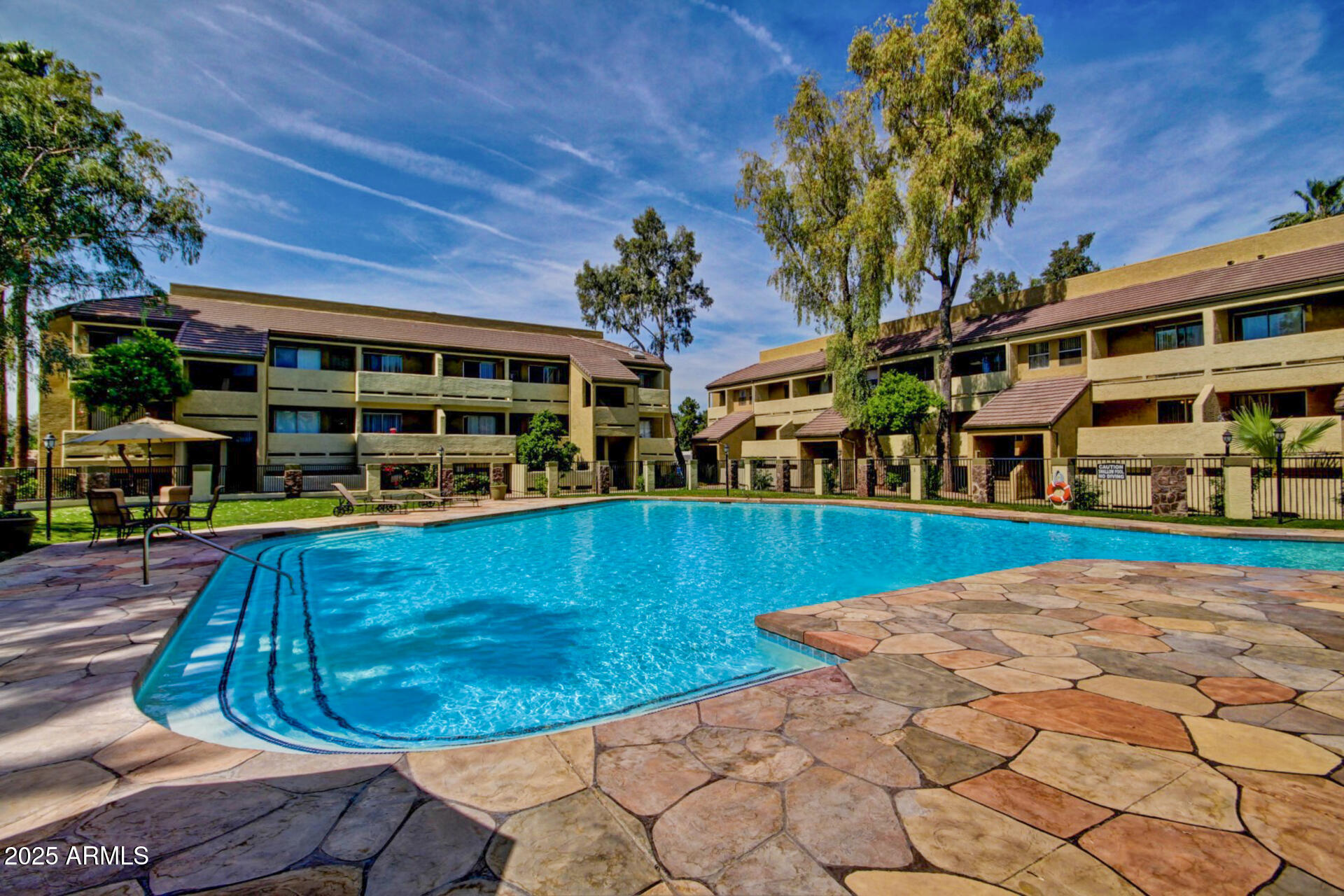 1331 West Baseline Road, Unit 167 Mesa, AZ 85202 - Photo 30 of 42 a view of a swimming pool with a patio