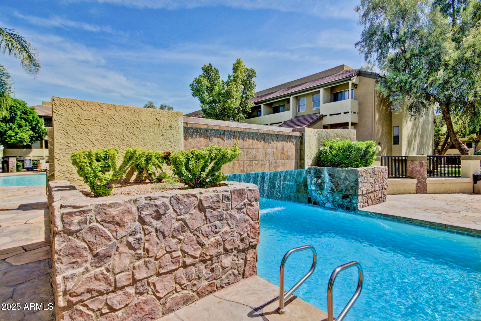 1331 West Baseline Road, Unit 167 Mesa, AZ 85202 - Photo 33 of 42 a view of a chairs and table in the backyard