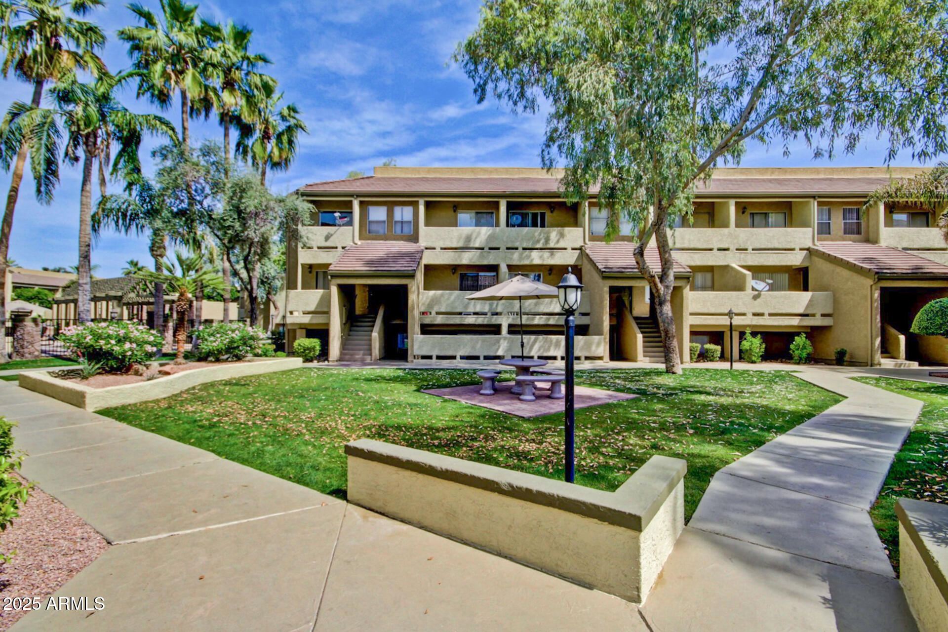 1331 West Baseline Road, Unit 167 Mesa, AZ 85202 - Photo 40 of 42 a front view of a residential houses with yard and green space