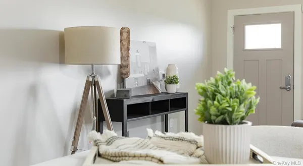 a bedroom with a bed and a lamp