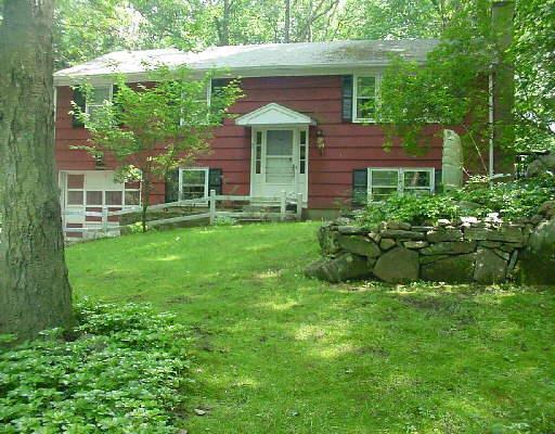 51 Olmstead Road Redding, CT 06896 - Photo 1 of 1 a front view of a house with a garden