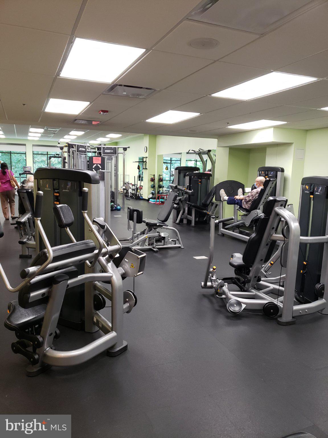 15100 Interlachen Drive, Unit 4520 Silver Spring, MD 20906 - Photo 35 of 39 Modern fitness center with diverse equipment.