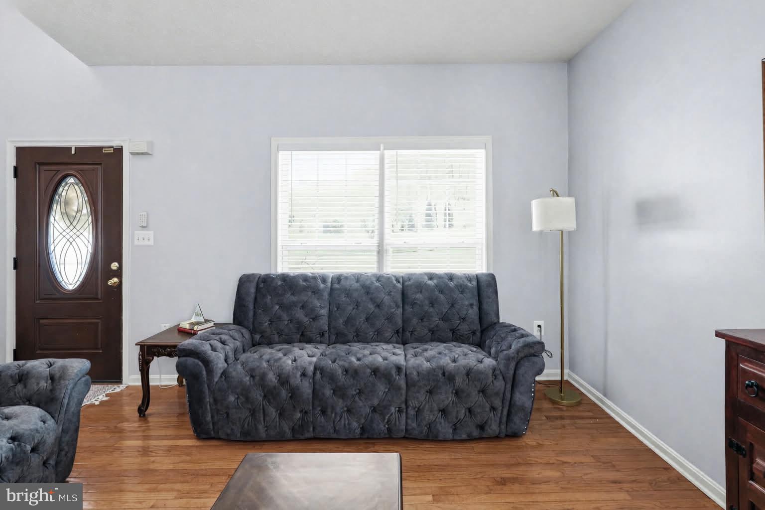 209 Estate Drive Ruther Glen, VA 22546 - Photo 13 of 67 a living room with furniture and a window