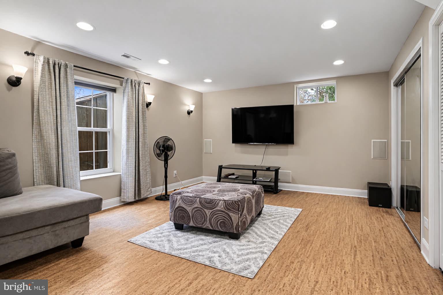 209 Estate Drive Ruther Glen, VA 22546 - Photo 29 of 67 a living room with furniture and a flat screen tv