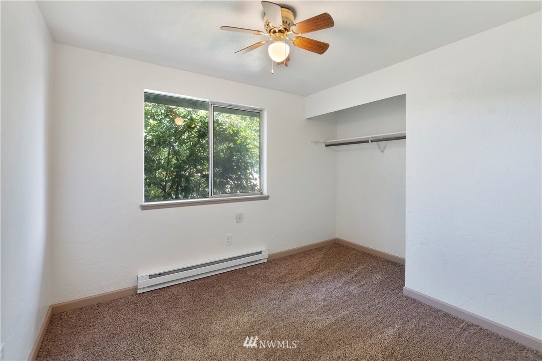 18805 Guava Street Southwest Rochester, WA 98579 - Photo 14 of 20 an empty room with a window and a fan