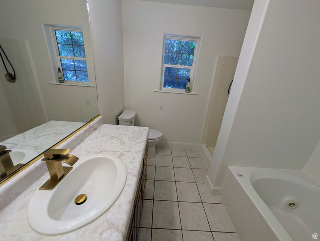 441 Main Street Hurricane, UT 84737 - Photo 16 of 29 Bathroom featuring a single vanity with a gold-tone faucet, a white undermount sink, and a marble-finish countertop