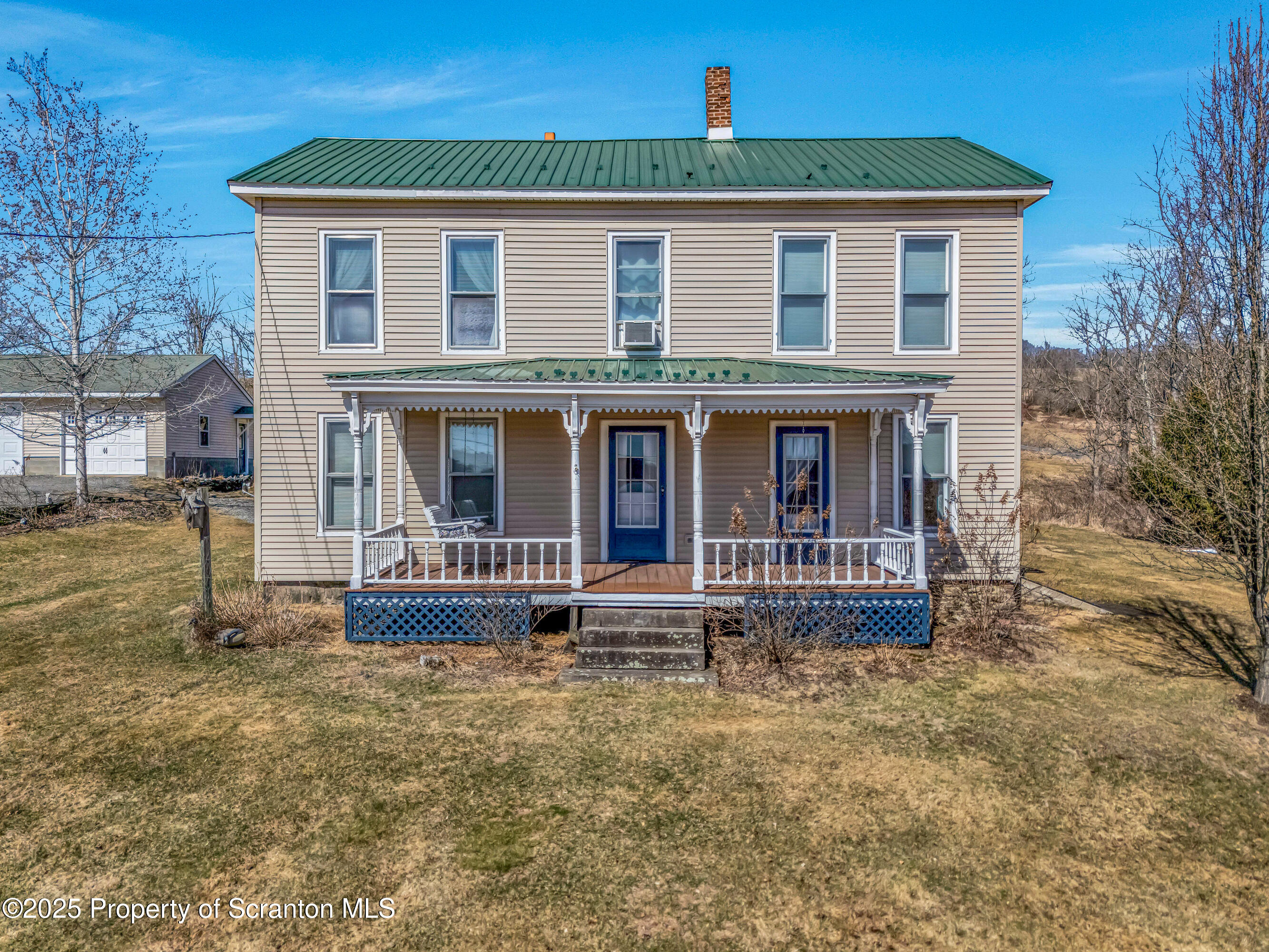 5115 State Rte 3013 Springville, PA 18844 - Photo 4 of 74 a front view of a house with garden