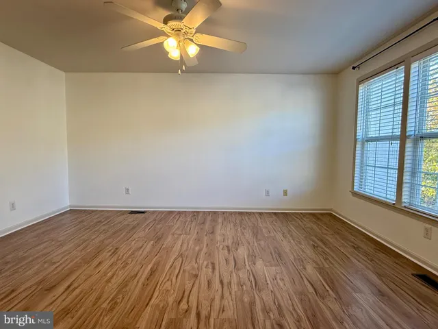 a spacious bathroom with a tub sink shower and mirror
