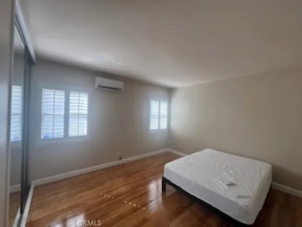 a room with window and wooden floor