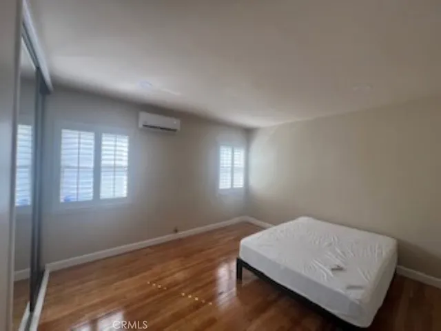 a room with window and wooden floor