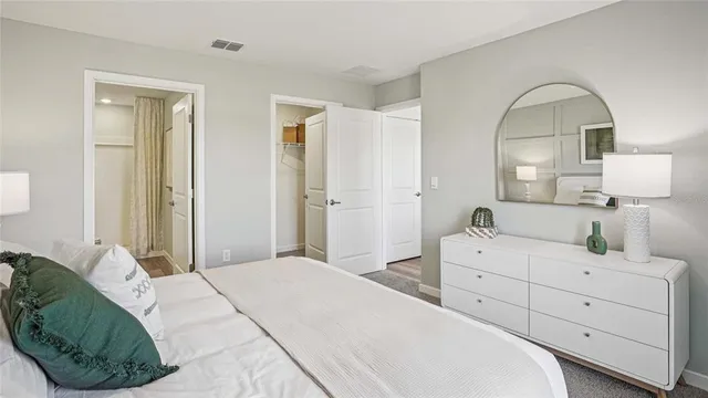 a bedroom with a bed and a dresser