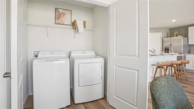 a utility room with dryer and washer